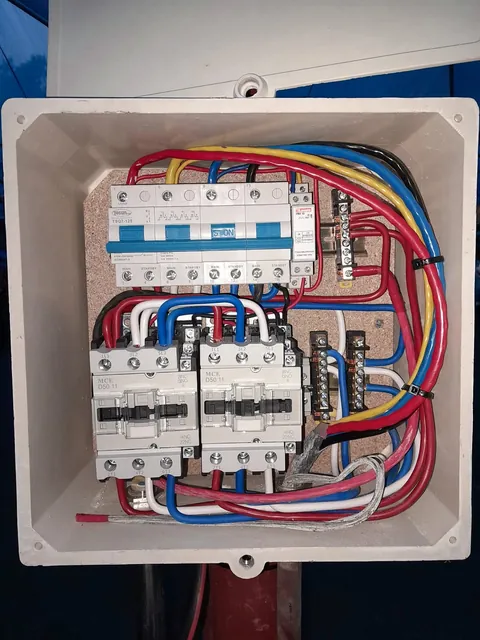 Enclosure with a changeover breaker, phase sequence relay and two contactors
